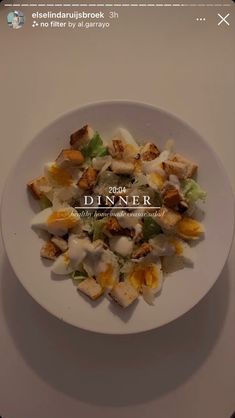 a white plate filled with food on top of a table