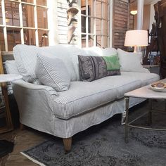 a living room filled with furniture and decor