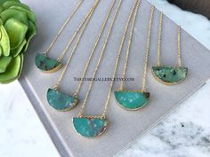 **Each piece in my shop, I personally create and photograph. (All photos are property of The Cord Gallery LLC) Thank you for supporting my small business. These stunning and natural necklaces are made from Green Chrysoprase Slices that have been cut into half moon shapes. Each is trimmed in gold electroplating and hangs on your choice of 14k Gold Plated or 14k Gold Filled chain in the length of your choosing. The stones are double sided so they look pretty no matter how they lay. Choose how you' Untreated Jade Jewelry For Gift, Untreated Jade Jewelry Gift, Gold Chrysoprase Necklace For Gift, Chrysoprase Necklace With Large Stone As Gift, Chrysoprase Round Pendant Necklace As Gift, Chrysoprase Round Pendant Necklace For Gift, Untreated Green Pendant Necklace, Nature-inspired Chrysoprase Necklace As Gift, Nature-inspired Chrysoprase Necklaces As Gift