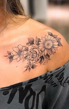 a woman with a flower tattoo on her shoulder