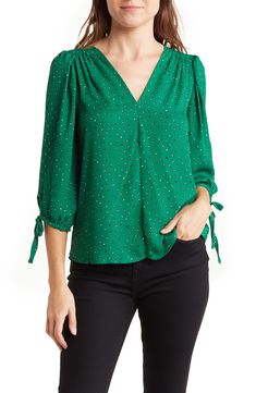 Artistic dots printing accentuates a lightweight top that is framed by a V-neckline and bracelet-length sleeves. 23" length (size S) V-neck Bracelet-length sleeves 100% polyester Hand wash, line dry Made in the USA of imported fabric Model stats: 5'10" height, 32" bust, 25" waist, 36" hip. Model is wearing size S. Neck Bracelet, Burmese Clothing, Tie Sleeve Blouse, Floral Long Sleeve Shirt, Plus Size Dress Outfits, Fancy Dresses Long, Women Blouse, Tie Sleeve, Women Blouses