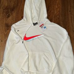 White Nike Hoodie- Orange Swoosh White Urban Hoodie With Logo Print, Nike Sporty Hoodie With Graphic Print, Nike Casual Hoodie With Graphic Print, Casual Nike Hoodie With Graphic Print, White Logo Print Sweatshirt For Streetwear, White Letter Print Hoodie For Spring, Spring White Hoodie With Letter Print, White Hooded Sports Top, White Hooded Top For Sports