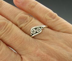 Sterling Silver Scroll Ring/ Silver Wave Ring/ Double Swirl Ring/ Silver Swirl Ring/ One of a Kind Ring/ Silver Thumb Ring/ Handmade Ring R1198- Sterling Silver Handmade One of a Kind ring. The scrolls or swirls give it a Victorian or Egyptian feel. Comfortable Low Profile One of a Kind Ring. It is a size 9. I can size it to fit, just contact me. No charge to size down, and no charge for one size up. Would make a nice Thumb Ring. The top of the ring measures 8 mm and the band is 2 mm. This ring Sterling Silver Swirl Jewelry, Handmade Silver Filigree Toe Ring, Sterling Silver Swirl Rings For Gift, Unique Silver Swirl Ring, Handmade Sterling Silver Swirl Rings, Scroll Ring, Thumb Rings Silver, Swirl Ring, Artisan Rings