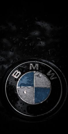 the bmw logo is shown on a black background