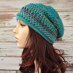 "Fun and playful, this cozy hat has great style and texture. Crocheted from a 100% acrylic yarn, this striped beauty ranges in shades of teal, blue and aqua and will be your favorite go-to hat. This hat has a rasta type slouch and fits an average teen or adult head of 20 to 22 inches. Hand wash, dry flat. Every item from Pixiebell is handmade and knit or crocheted to order, unless otherwise stated in title of the item as \"ready to ship\". Production time may vary, please check the SHIPPING &amp Beanie Slouchy, Teal Hat, Crochet Slouchy Beanie, Summer Beanie, Stitch Hat, Crochet Slouchy Hat, Hats Crochet, Crochet Hat For Women, Crocheted Hat