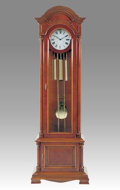 an antique grandfather clock with pendulums on the front and sides, in mahogany wood