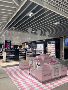 the inside of a store with pink and white checkered flooring