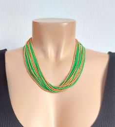 Kelly Green , Gold Multistrand Boho, Seed Bead Statement Necklace, for her, green necklace, bohemian necklace, beaded necklace The size shown on the model is 18". Please read specifications on SIZES below: ###SIZES This item comes in several sizes, kindly choose at checkout. The easiest way to find out which length suits you best is to measure a necklace you already own, from one end to the next, including clasp. You can also use the diagram on the pictures as a reference, but keep in mind that Green Multi-strand Beaded Necklaces For Festivals, Green Multi-strand Beads For Gifts, Green Multi-strand Beaded Necklace For Festival, Green Long Beaded Necklaces With Faceted Beads, Green Beaded Long Necklace With Faceted Beads, Green Multi-strand Beach Necklaces, Green Long Beaded Necklace With Faceted Beads, Green Multi-strand Necklace For Beach, Green Long Necklace With Faceted Beads