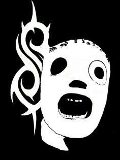 a white mask with black eyes and flames on it