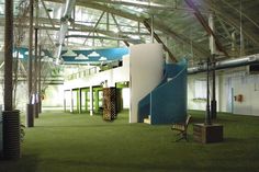 the inside of an office building with green carpet