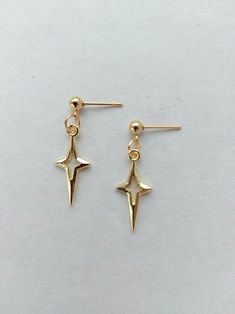 The earrings are adorned with a small star-shaped pendant. The earrings are fastened with stainless steel studs. Earring length - 3.0 cm (1.2 inches) The earrings are packed in a gift box. RECOMMENDATIONS FOR CARE: Do not wet, do not drop, and store in a dark box! - Remove jewelry before exercising, swimming, showering and sleeping. - Avoid contact with moisture such as make-up, moisturizer, lotion, perfume and hairspray. - Store your jewelry in a box or pouch after use. Girlfriend Earrings, Earrings Grunge, Polar Star, Bee Cookies, Celestial Earrings, Starburst Earrings, Gothic Earrings, Dope Jewelry, Jewelry Lookbook