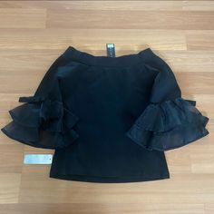 Ruffle Sleeves Black Blouse With Ruffle Hem For Party, Black Stretch Blouse With Ruffles, Elegant Black Blouse With Ruffle Hem, Stretch Black Blouse With Ruffles, Elegant Black Top With Ruffle Hem, Spring Black Blouse With Ruffle Hem, Ruffle Sleeves, Top Blouse, Blouses