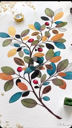 a painting with leaves and berries painted on the paper next to some crayons