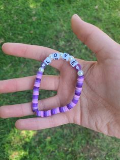 "This is the Lavender Love bracelet! This bracelet has gorgeous shades of purple with the word \"Love\" right in the middle! This bracelet is super stunning. I can imagine paring it with a simple white & purple aesthetic outfit! If you love the thought of love, and love the color purple, this bracelet is made just for you! <3" Personalized Purple Wristband For Friendship, Purple Friendship Bracelets With Letter Beads, Personalized Purple Beaded Bracelet, Personalized Purple Bracelets For Everyday, Everyday Personalized Purple Bracelets, Personalized Purple Bracelet For Everyday, Trendy Personalized Purple Friendship Bracelets, Trendy Personalized Purple Bracelets, Trendy Purple Friendship Bracelets