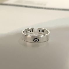 The open "I Love You" ring from Vielring is ideal for a gift for your loved one. Because the ring can be individually adjusted in size, it fits almost any finger. The love ring has an unadjusted ring size of 17 mm. The main material is 925 sterling silver, but this can be chosen individually. We also offer this ring with 18K gold plating. All Vielring rings are lead, nickel and cadmium free! This ring is also unisex. Please also have a look at the other love rings in our shop: https://www.etsy.c Couple Ring Silver, I Love You Ring, Ring Couple, Bridesmaid Gifts Jewelry, Couple Ring, Couple Rings, Love Ring, Open Ring, Copper Color