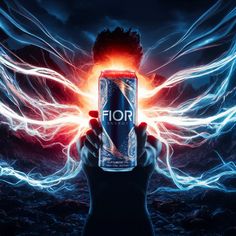 a person holding up a can of fior energy drink