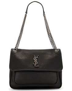 The YSL Medium Niki Chain Bag is a symbol of refined elegance and timeless sophistication, meticulously crafted in Italy from grained calfskin leather, adorned with a grosgrain lining. Its exquisite design is accentuated by the flap top closure, secured with a magnetic button and embellished with brushed silver-tone Cassandre hardware at the front, adding a touch of understated luxury. The bag's interior features a spacious main compartment, complete with a zipper pocket and leather slip pocket, Balenciaga Designer, Chain Bag, Chain Bags, Modern Fashion, Leather Slip Ons, Vintage Leather, Leather Shoulder Bag, Designer Shoes, Luxury Bags