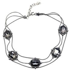 A sublime Vintage Christian Dior Blackened Crystal Choker from Galliano's much revered tenure at the House. Large faceted smoky grey crystals adorn a line of gunmetal rope link chain, almost wire-like. Contemporary in overall design with the exceptional Dior attention to detail, such as the intricacy of the metal patterning on the clasp and the front and reverse of the stations and finished with the classic Dior hang tag with CD pendant. A wonderfully edgy yet glamorous piece from the House. Wit Necklace 2000s, Dior Designer Of Dreams, Classic Dior, Grey Crystals, Dior Collection, Crystal Choker Necklace, Dior Designer, Vintage Christian Dior, Crystal Choker