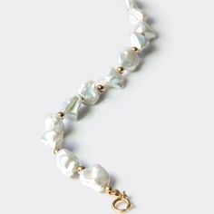 Elegant Pearl Bracelet For The Beach, Elegant Pearl Bracelet For Beach, Elegant Single Strand Pearl Necklace For Beach, Elegant Pearl Bracelets For Beach, Elegant Hand-strung Jewelry For Beach, Elegant Hand-strung Beach Jewelry, Elegant Handmade Beaded Bracelets For Beach, Elegant Hand-strung Beaded Bracelets For Beach, Baroque Pearls