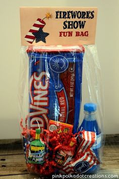 a bag filled with candy and snacks sitting on top of a wooden table