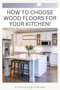 a kitchen with white cabinets and an island in the middle that says how to choose wood floors for your kitchen