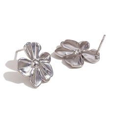 Add a pop of fun to your spring wardrobe with these Flower Statement Earrings! These large flower earrings are the perfect accessory to make a statement with your outfit. Embrace the spirit of the season with these playful and quirky earrings. DETAILS & SIZE Sold as a pair Finish: 18K gold plate Material: Stainless Steel Measurements: Large: 29mmx33mm; Medium: 19mmx16mmmm Weight: Large: 10.8 grams; Medium: 3.5 grams Comes with friction earring backs Waterproof, tarnish-resistant, and nickel free Shop Earrings to curate your ear stack! Flower Statement Earrings, Classic Flower, Quirky Earrings, Silver Statement Earrings, Flower Ear, Ear Stack, Waterproof Jewelry, Small Earrings Studs, Dainty Bracelets