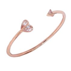 Handcrafted Of Rose Gold-Tone Metal, This Rock Solid Flex Cuff Is Embellished At The Ends With Two Of Kate Spade Signatures: A Heart And The Tip Of The Spade. They Punctuated It With Sparkling Faceted Crystals For The Finishing Touch. Rose Gold Metal, Crystal Glass Slides On Spade-B2 Weight: 4g Inner Circumference: 2.2" X 1.9" Handcrafted Smoke-Free As Well As Pet-Free Home Retail: $119 Kate Spade Bangle Bracelets For Party, Adjustable Pink Kate Spade Bracelet, Adjustable Pink Kate Spade Bracelets, Kate Spade Party Bangle, Kate Spade Party Bangle Jewelry, Kate Spade Bangle For Party, Adjustable Pink Kate Spade Jewelry, Adjustable Rose Gold Heart Bangle Bracelet, Kate Spade Rose Gold Bracelets For Gift