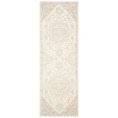 a white and beige rug with an ornate design on the bottom, in front of a white background