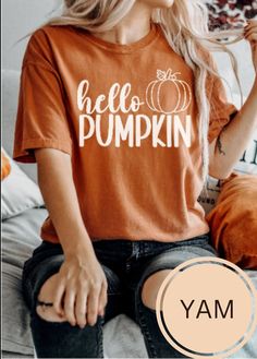 This cute Hello Pumpkin shirt comes on the raved about comfort colors t-shirt. This shirt is perfect to kick off the Fall season. Be ready for Fall in this cute tee. Get one for yourself and your pumpkin loving friends. PRODUCT DETAILS - Comfort Colors - Garment-dyed T-shirt - 100% Ring-spun Cotton - Soft-washed, Highly Durable, Garment-dyed Fabric - Unisex fit - please refer to the size chart in the listing photos for most accurate measurement DESIGN AND PRINT INFORMATION - Direct to garment pr Fun Fall T-shirt With Screen Print, Fun Fall Screen Print T-shirt, Cute Crew Neck T-shirt With Heat Transfer Vinyl, Fun Screen Print T-shirt For Fall, Cute Orange T-shirt With Letter Print, Cute Orange Cotton T-shirt, Casual Relaxed Fit Shirt With Heat Transfer Vinyl, Trendy Cotton T-shirt With Heat Transfer Vinyl, Casual T-shirt With Heat Transfer Vinyl And Crew Neck