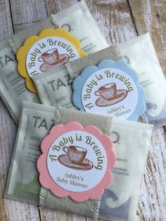 four baby's brunch tea bags with labels on them sitting next to each other