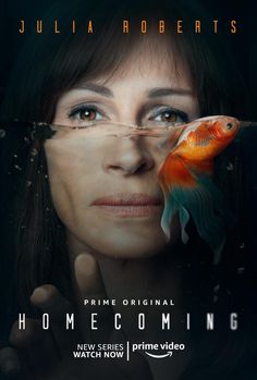 a woman holding a goldfish in front of her face with the caption home coming