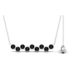 Product Details Make a statement at any party or special occasion with this elegant and chic Black Onyx Necklace. The necklace features Round Cut Black Onyx stones in a Bezel Setting, arranged in a stunning Nine Stone Bar Necklace design. Crafted from high-quality Gold, this necklace is sure to elevate any outfit with its sophisticated style. Product Information SKU SHP-PENDANT042159316 Length 5.8 mm Width 32 mm Weight 3.76 gm (Approximate) BLACK ONYX INFORMATION No.of Stones 9 Pieces Total Weight 0.81 Carat (Approximate) Dimension(approx) Round-3X3 mm-9 Pcs Color Black Cut Brilliant Shape Round Setting Type Bezel-Setting Quality Grade AAA View More Product Parent Collection Handle black-onyx-necklaces Modern Black Necklace For Evening, Modern Black Necklace For Party, Modern Black Necklaces For Parties, Onyx Bar, Stone Bar, Black Onyx Necklace, Onyx Necklace, Black Onyx Stone, Necklace Design