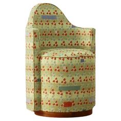 an upholstered chair with hearts on the back and arms, made out of fabric