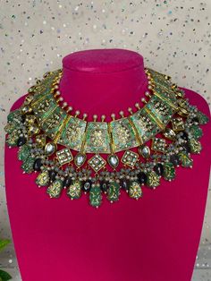 This Beautiful Rajasthani set comes with matching earrings and it made of high quality handwork and kundan work. The handpainted colors are beautiful and can go with many outfits as a statement piece. It is made from high quality stones and is a full choker that covers the neckline. The work is intricate and very beautiful in person. Rajasthani Necklace, Sabyasachi Collection, Punjabi Jewelry, Silver Round Earrings, Meenakari Necklace, Polki Choker, Kundan Work, Polki Earrings, Kundan Choker