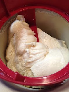 a red container filled with ice cream on top of a counter