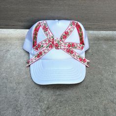 Super cute and unique one of a kind trucker hat with oversized flower ribbon bow. The perfect mix of sporty and feminine/boho vibes - its an easy accessory to add style to any wardrobe and would make a great gift for women! Each hat comes with my sun logo patch sewn on the back as shown in the last picture. Adjustable SnapBack closure Whimsical White Cap Hats, Cute Festival Trucker Hat, Vintage White Trucker Hat For Spring, Cute Festival Hats One Size Fits Most, Trendy Handmade Trucker Hat For Festivals, Handmade Trendy Trucker Hat For Festivals, Whimsical White Adjustable Hat, Adjustable Baseball Cap As Summer Gift, White Snapback Mini Hats For Spring