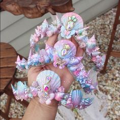 a hand holding some very pretty hair clips