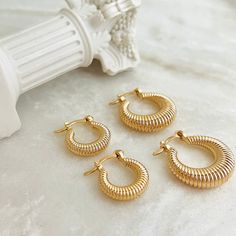 A dainty pair of small twisted gold filled hoops. These gold croissant hoops are available in two sizes to best suit your preference. Their twisted rope design make them a versatile piece that is sure to enhance the beautiful facial features of anyone wearing them! ⭐️Item Description:  Small Hoop Size: 16 x 4mm (Diameter - 9mm) Medium Hoop Size: 22 x 6mm (Diameter - 12mm) Benefits: Lightweight, Water & Tarnish Resistant, Hypoallergenic  ⭐️About Our Hoops: Our hoop collection ranges in shape, siz Gold Spiral Hoop Earrings For Everyday, Gold Filled Hoops, Rope Design, Light Weight Earrings, Jewelry Earrings Hoops, Gold Filled, 18k Gold, Twist, Etsy Earrings