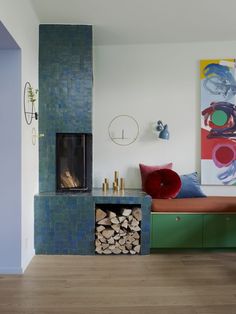 a living room filled with furniture and a fire place next to a painting on the wall