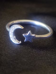 A delicate and beautiful Sparkling moon and star ring with CZ accents. Very feminine and dainty. We strive to provide you with a meticulously crafted piece of beautiful jewelry. All of our rings come with a high shine finish and are made with the highest quality of materials. We use the purest 925 Sterling Silver along. You will surely be impressed with the quality of this ring when you see it! *The price is for one ring 925 sterling silver. Moon is accented with sparkling CZ's The perfect delicate gift for the moon goddess in you. This ring is great for stacking! Your jewelry purchase will come in a beautiful gift box, ready for gift giving to that special someone or just yourself! 👉 Sterling Silver 👉 Adjustable for Perfect Fit 👉 Symbol of Good Luck 👉 Cultural Significance Adorned 👉 Moon And Star Ring, When You See It, Moon Ring, Pretty Jewelry, Moon And Star, Silver Moon, Moon Goddess, Star Ring, Moon Star