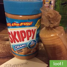 a jar of peanut butter next to a plastic bag