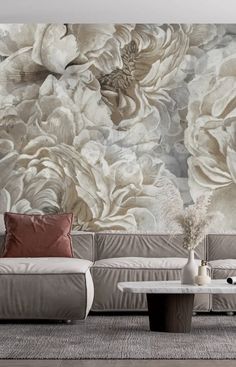 an elegant living room with floral wallpaper and couches in front of the large mural