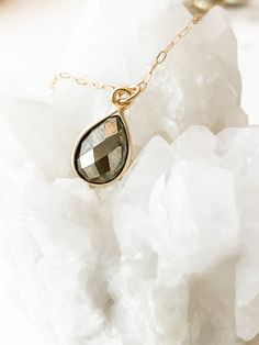 This necklace was worn on Law & Order's SVU "Return of the Prodigal Son", episode 9, season 22 and on Organized Crime "What happens in Puglia" episode 1, Season 1 on Kathleen Stabler, played by Allison Siko. The faceted pyrite semi-precious teardrop gemstone hangs from a dainty chain. It has a 1" + 1" extender and adjusts from 16" to 18" in length. Choose from sterling silver (.925) or Gold Filled. Your necklace comes tastefully packaged and ready for gift-giving in a beautiful box with microsue Spiritual Gold Crystal Necklace For Anniversary, Gold Faceted Briolette Drop Necklace, Gold Teardrop Crystal Necklaces With Adjustable Chain, Gold Teardrop Crystal Necklace With Adjustable Chain, Gold Briolette Drop Necklace As Gift, Gold Briolette Drop Necklace For Gift, Gold Faceted Spiritual Necklaces, Gold Faceted Pendant Necklace, Spiritual Gold Crystal Necklaces With Teardrop Pendant