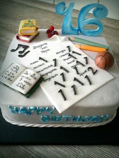 a birthday cake with writing and sports items on it