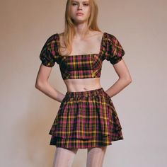 New With Tags. Plaid Top And Skirt Set From Uo. Top Is Cropped Above The Waist With A Straight Neckline And Puff Sleeves. Skirt Is High-Rise With A Tiered Hem. - 66% Polyester, 32% Viscose, 2% Spandex Y2k Fitted Tiered Mini Skirt, Fitted Mini Skort In 90s Style, Fitted 90s Style Mini Skort, Fitted Yellow Tiered Mini Skirt, Y2k Tiered Mini Skirt For Summer, 90s Fitted Mini Skirt For Spring, 90s Style Fitted Mini Skirt For Spring, 90s Style Mini Skort For Summer, Urban Outfitters Fitted Tiered Skirt