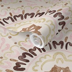 a close up view of a wallpaper with brown, pink and white designs on it