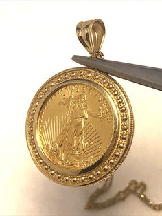 * Designer AE 14K Yellow Gold 1/10 Oz Fine $5 Gold Coin Round Pendant Necklace * Length: 31" * Pendant length including bale: 1-3/16" * Pendant width: 7/8" * Coin measures: 16.57mm round * Pendant is marked: 14K * AE  * Chain is marked: 14KT * AE  * Coin is marked: 2016 * Liberty * 1/10 oz. Fine Gold * 5 Dollars * MB * JW * Weight: 5.7 tgw * Closure: Lobster * Condition: As pictured. * G3992    Exported By ExportYourStore :) 5 Dollars, Round Pendant Necklace, Gold Coin, Gold Coins, Round Pendant, Necklace Length, Favorite Jewelry, Necklace Etsy, Jewelry Necklace Pendant