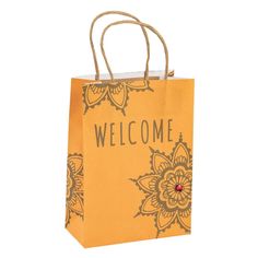 a yellow paper bag with the words welcome on it