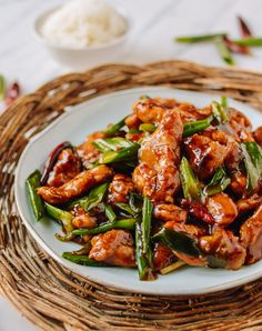 a white plate topped with chicken and asparagus