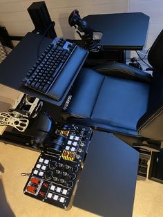 a laptop computer sitting on top of a desk next to a keyboard and mouse pad